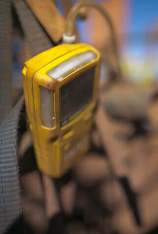 A meter measures hydrogen sulfide levels on a worksite.