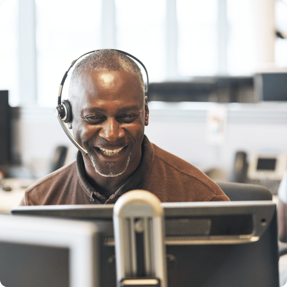 A man smiling on a call 