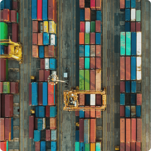 An aerial shot of a shipping containers in a port 