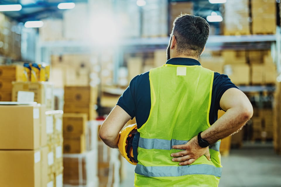 worker navigating ergonomic hazards on the job site