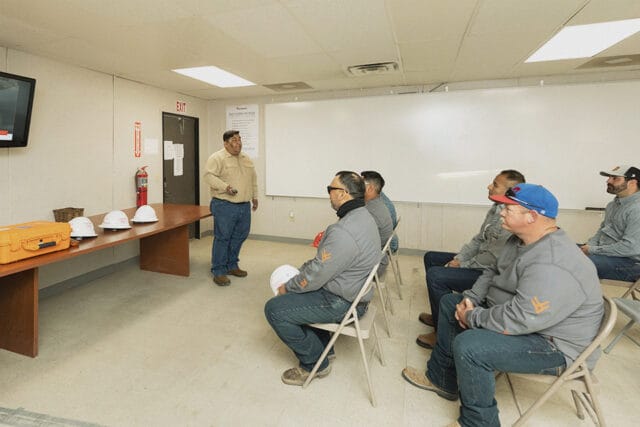 Workers participate in SafeLand training basic orientation.